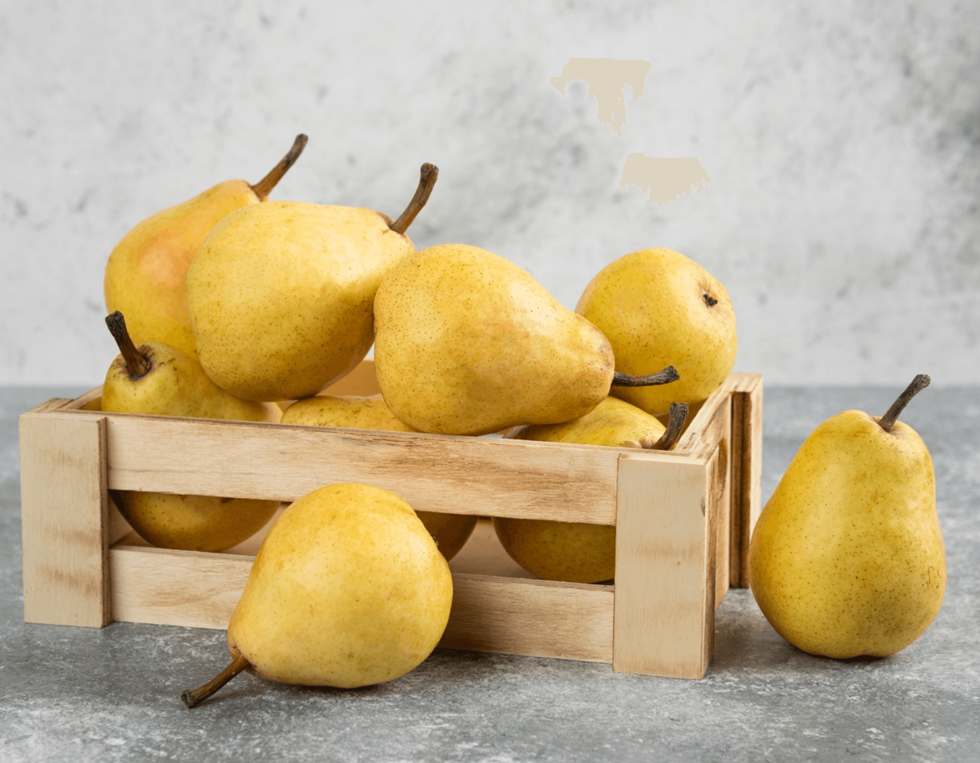 Golden pears in a wooden crate for commercial food-service use